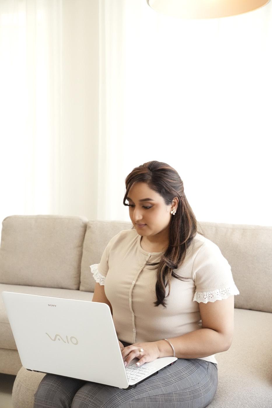 Khushpreet Sran reviewing a client's financials